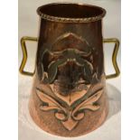 An Arts and Crafts copper vase, embossed with coat of arms and fleurs de lys, brass handles, 18.