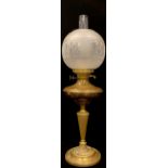 A late 19th century brass oil lamp, globular acid etched shade, clear glass chimney, twin burner