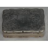 An Edwardian silver shaped rectangular snuff box, hinged cover engraved with scrolling foliage, gilt