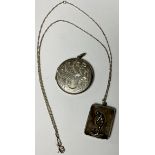 Jewellery - cricket interest - a 19th century silver locket and chain, the locket with cricketer,