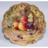 A Royal Worcester shaped circular plate, painted by T. Lockyer, signed, with ripe fruit on a mossy