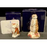 A Royal Crown Derby paperweight, Meerkat, gold stopper boxed; another, Marmalade Kitten, specially