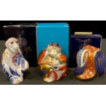 A Royal Crown Derby paperweight, Barbary Macque, gold stopper, boxed; others, Monkey and Baby,