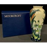 A Moorcroft Lamia pattern slender inverted baluster vase, tube lined with lily pads and bulrushes,