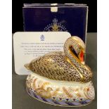 A Royal Crown Derby paperweight, Golden Jubilee Black Swan, Royal Doulton special commission to