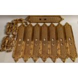 Interior Furnishings - a set of four gilt metal door plates, cast with trellis and flowerheads, 47cm
