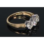 An 18ct gold diamond ring, the three brilliant cut claw set stones approx. 1.5ct total diamond