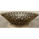 A silver coloured metal filigree basket, 17cm diam, 152g