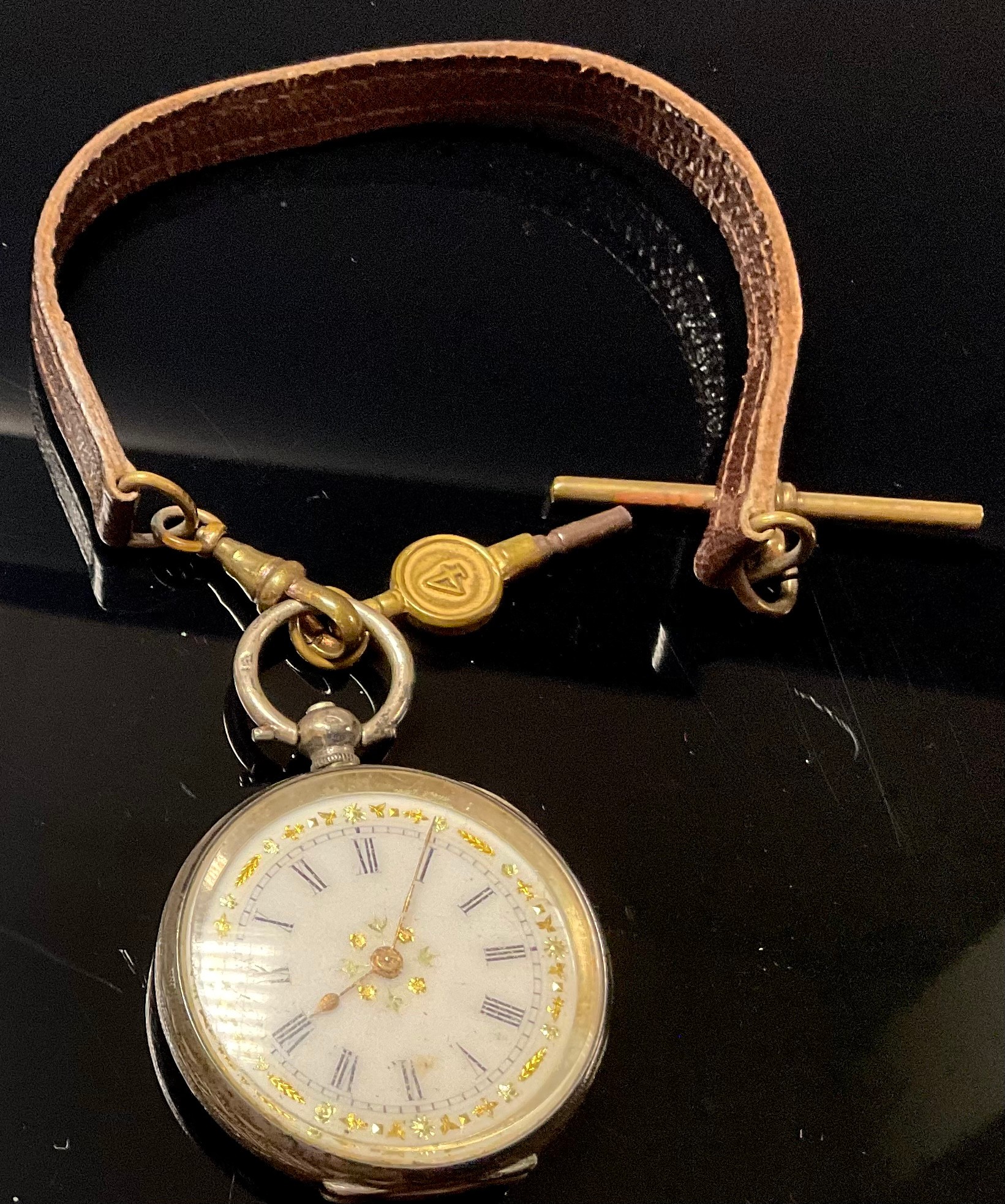 A late 19th century French silver lady's open face pocket watch, white enamel dial, the border