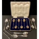 A set of six silver and enamel coffee spoons, bean terminals, Birmingham 1928, cased; a set of six