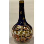A Royal Crown Derby 6299 pattern miniature bottle vase, 6cm, printed mark in green, date code for