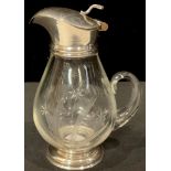 A silver mounted whisky noggin or liqueur jug, hinged cover, 14cm high, marked Sterling