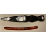 A miniature Japanese Samurai sword, lacquered sheath; a Scottish Dirk (2)