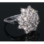 An 18ct gold diamond cluster ring, size M, 8.2g