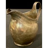 A George III silver helmet shaped cream jug, London 1807, 2oz