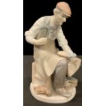 A Lladro figure, The Cobbler, 24.5cm high