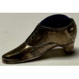A sterling silver miniature pincushion shoe, marked 925, 4cm long, 2cm high, 12g