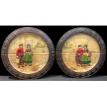 A pair of Bretby Pottery Dutch pattern circular wall chargers, decorated in low relief with