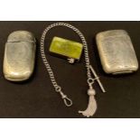 A Victorian rounded rectangular vesta case, 6cm long; another similar; a Victorian agate vesta case;