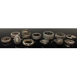 A collection of silver and silver coloured metal rings, mostly marked (12)