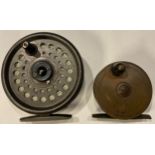 A brass fly fishing reel, 6.5cm diameter; an Intrepid Rimfly king size fishing reel (2)