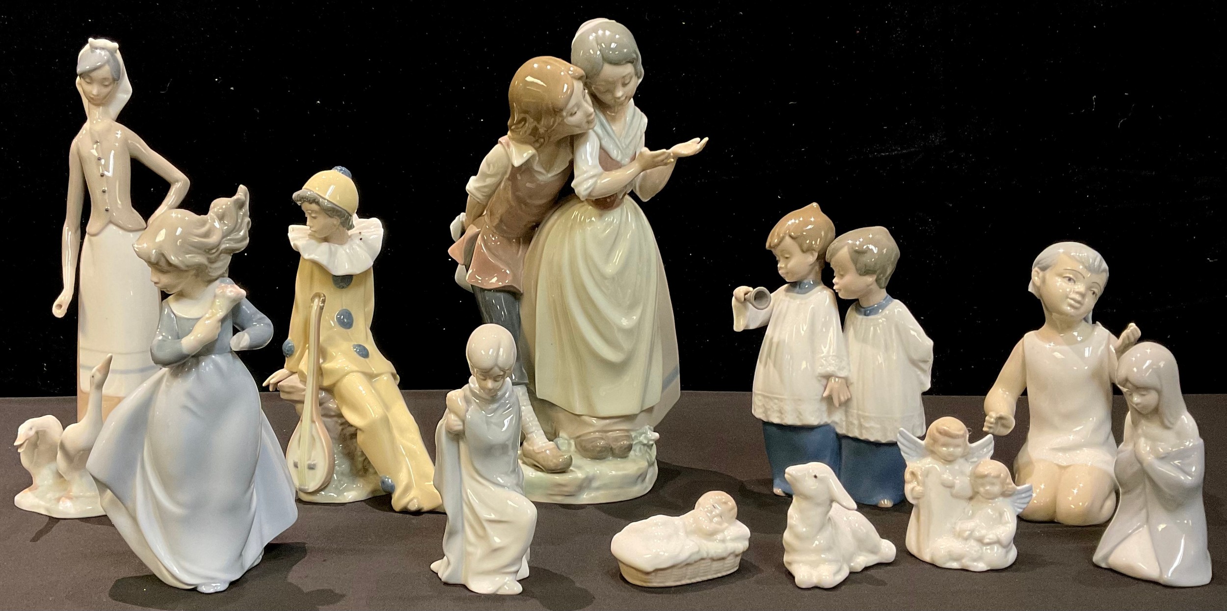 A Lladro figure group, of a Dutch girl and companion, 27cm high, printed mark; another, Goose