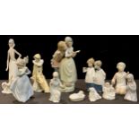 A Lladro figure group, of a Dutch girl and companion, 27cm high, printed mark; another, Goose