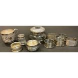 A pair of octagonal silver napkin rings, Sheffield 1945; other silver napkin rings; a silver two