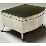 A George V silver bow front jewellery box, engine turned, vacant cartouche, fitted blue velvet