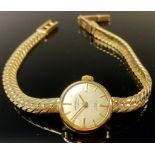 A lady's 9ct gold watch, silvered dial with baton indicators, Winegartens London, integral 9ct