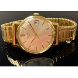 A gentleman's 9ct gold Longines watch, champagne dial, baton indicators, date aperture, centre