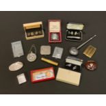 A miniature easel travel clock, cased; chrome engine turned visiting card case; a pair of silver