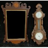 An Edwardian wall hanging combination aneroid barometer, thermometer and timepiece, of maritime