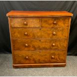 A Victorian mahogany chests, two short over three long graduated drawers, turned handles, 120cm