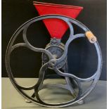 A cast iron S Nye & Co, no 6 size grain or flour grinder, red hopper, 24inch diameter handle,