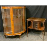 An Edwardian Arts and Crafts style mahogany side cabinet, single glazed door to centre, turned