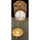 A 19th century French Comtoise type wall clock, embossed brass case, white enamel dial, signed