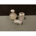 An Edwardian silver topper cut glass scent bottle, Birmingham 1907, rectangular box and cover,
