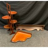 An Edwardian folding mahogany cakestand, with four platforms, splayed feet, 88.5cm high; a Victorian