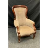 A Late Victorian mahogany library chair, carved hooped button back, upholstered in chocolate brown