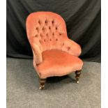 A button back library/nursing chair, serpentine seat, pink upholstery, turned fore legs, 92cm high