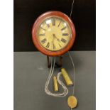 A late 19th century wall clock, cream dial, bold Roman numerals, twin weight driven movement,