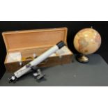 An Astronomical Telescope D60mm, F=700mm, wooden case with stand; Legends Population center table