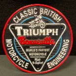 A painted cast iron sign, Triumph Bonneville, World Fastest Motorcycle, 24cm diameter