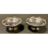 A pair of George V silver pedestal bon bon dishes, engraved Griffin crest, Walker & Hall,