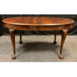 A Victorian mahogany dining table, oval top, cabriole legs, ball and claw feet, 73cm tall x 152cm