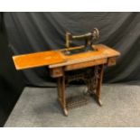 A Singer type 1 treadle sewing machine, serial no Y6224160, oak base
