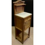 An early 20th century French marble top bedside cabinet / pot cupboard, carved oak back-splash