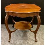 A late Victorian mahogany centre table, serpentine shaped-circular top, carved cabriole legs,