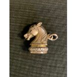 A novelty silver coloured metal and carnelian Horse head seal stamp, plain matrix, 2.7cm high